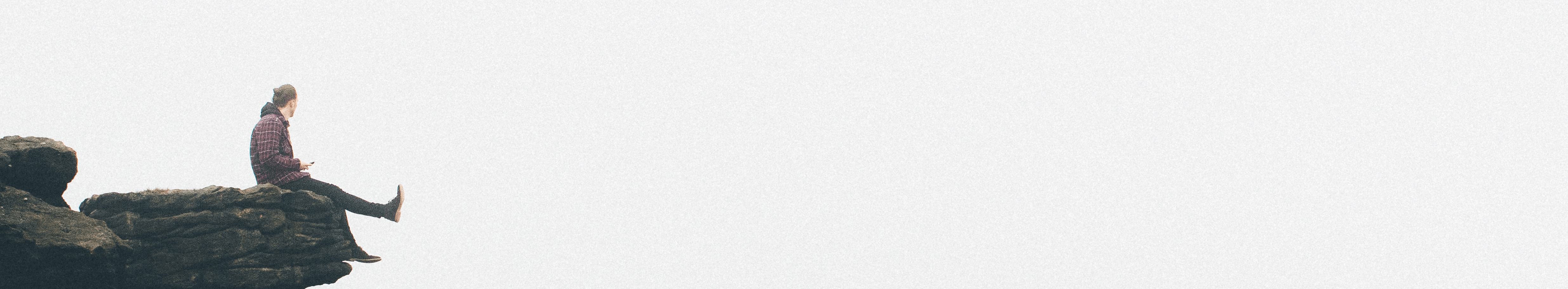 Banner - person sitting on rocks